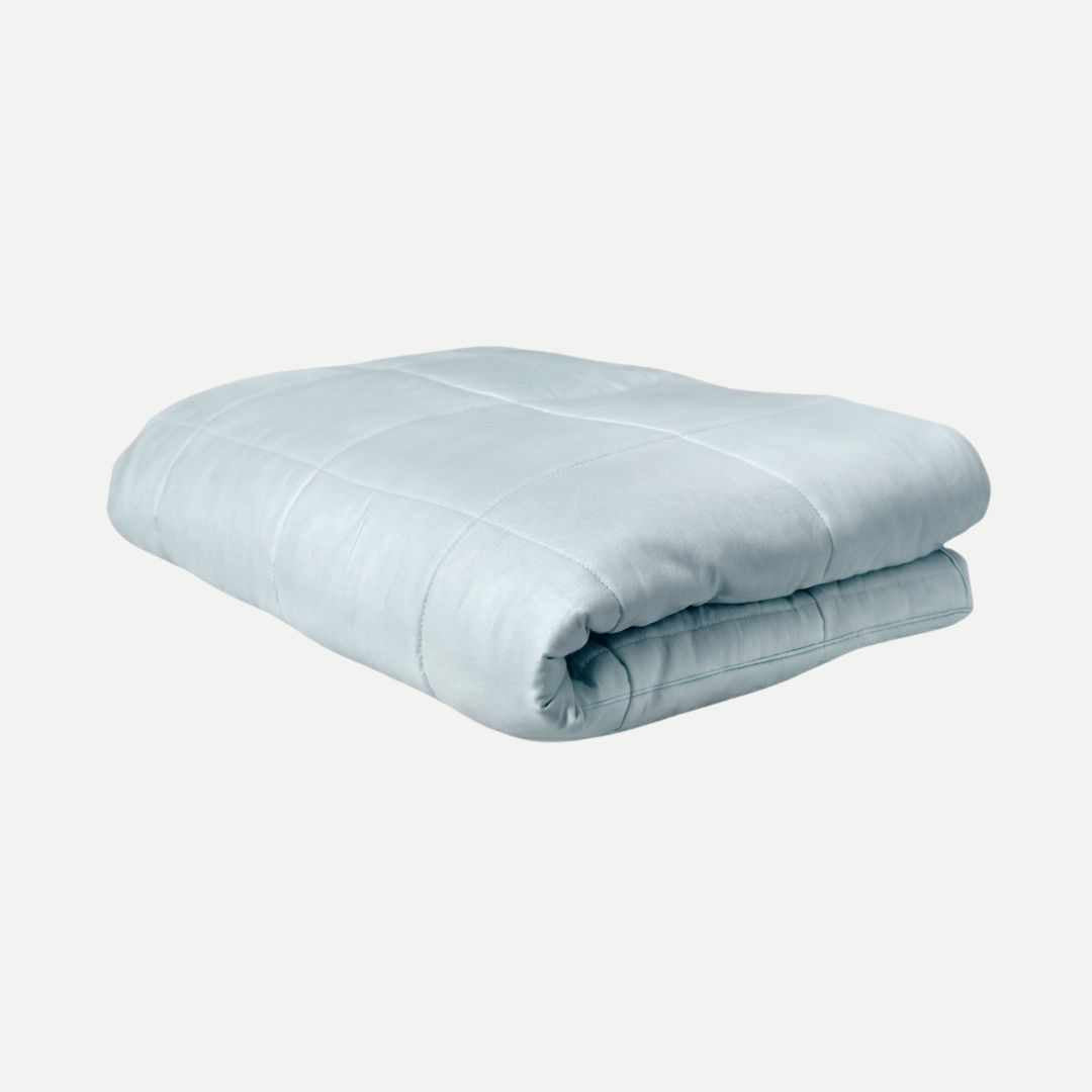 Folded weighted blanket on a white background