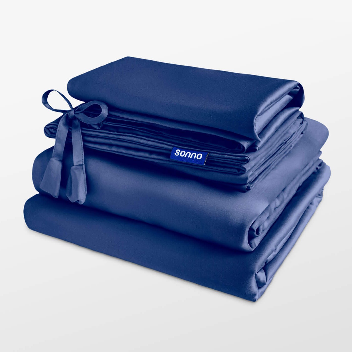 Stack of blue tencel sheets with 'sonno' branding on a light gray background