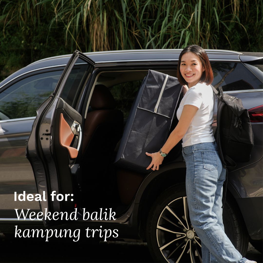 Woman loading a car with a black bag, ideal for weekend trips home.