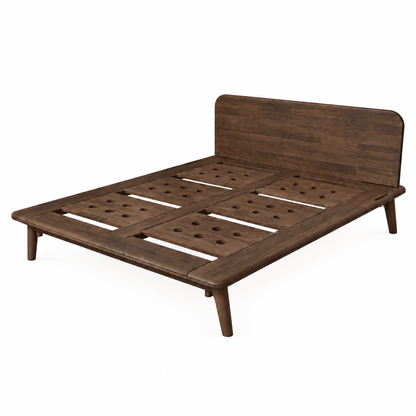 A dark brown wooden Sonno Signature bed frame with a slatted platform base and a matching headboard, shown from a three-quarters angle on a solid white background.