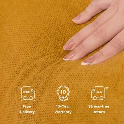 Close-up of a textured mustard yellow knit fabric with a hand resting on it, featuring white icons and text for Free Delivery, 10-Year Warranty, and Stress-free Return.