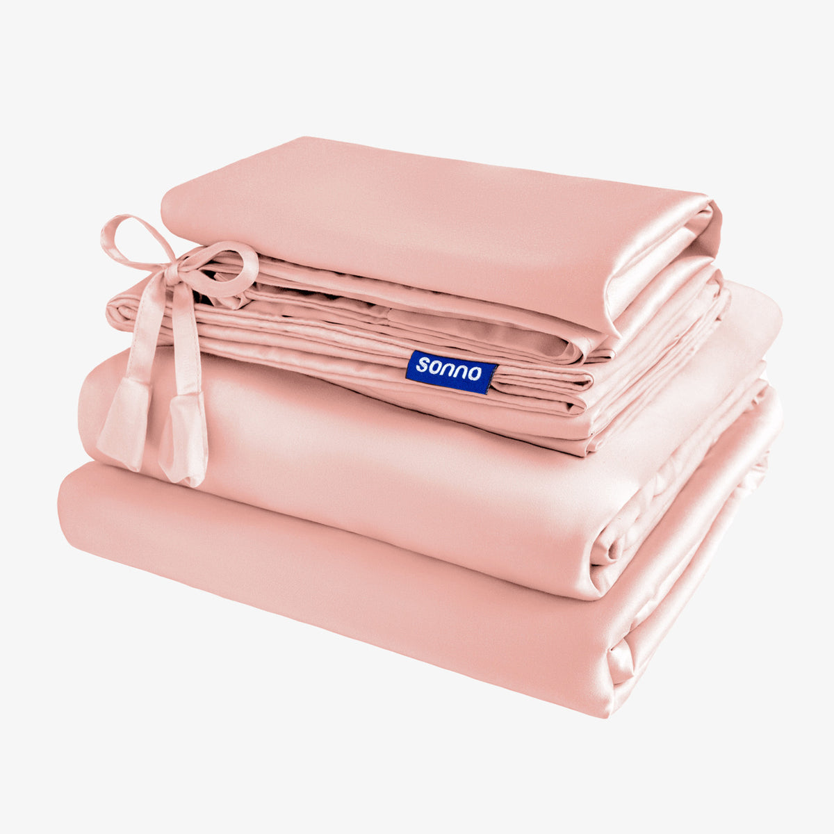 Folded pink blanket with a Sonno label on a white background