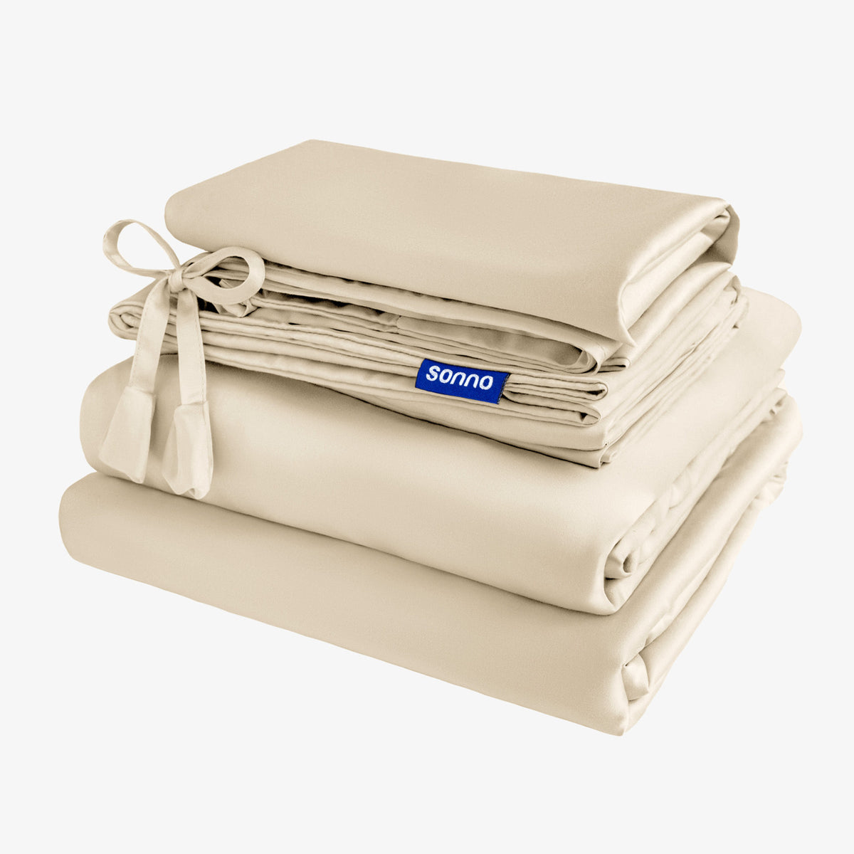 Folded beige bed sheets with a Sonno label on a white background