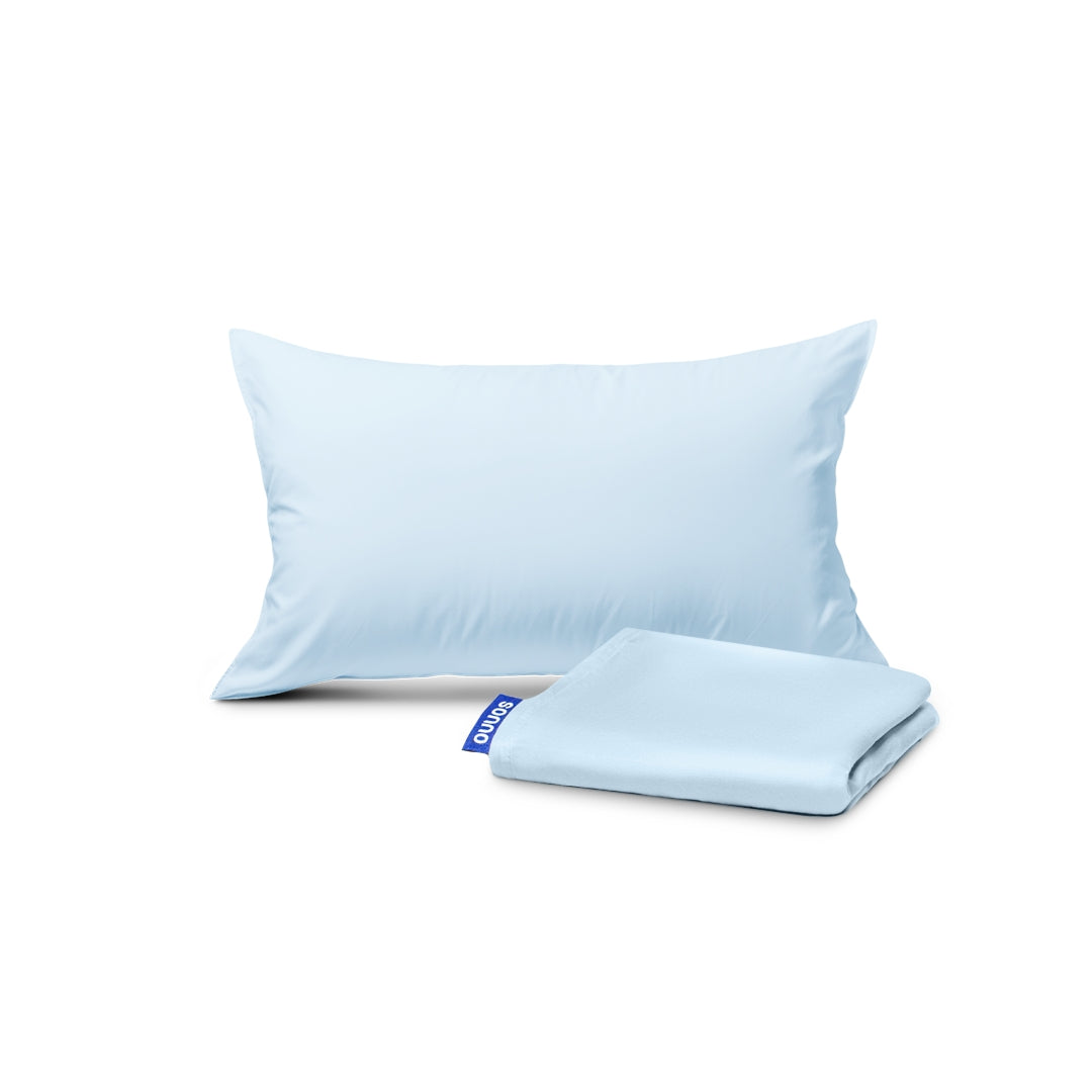 Light blue pillowcase and folded sheet on a white background
