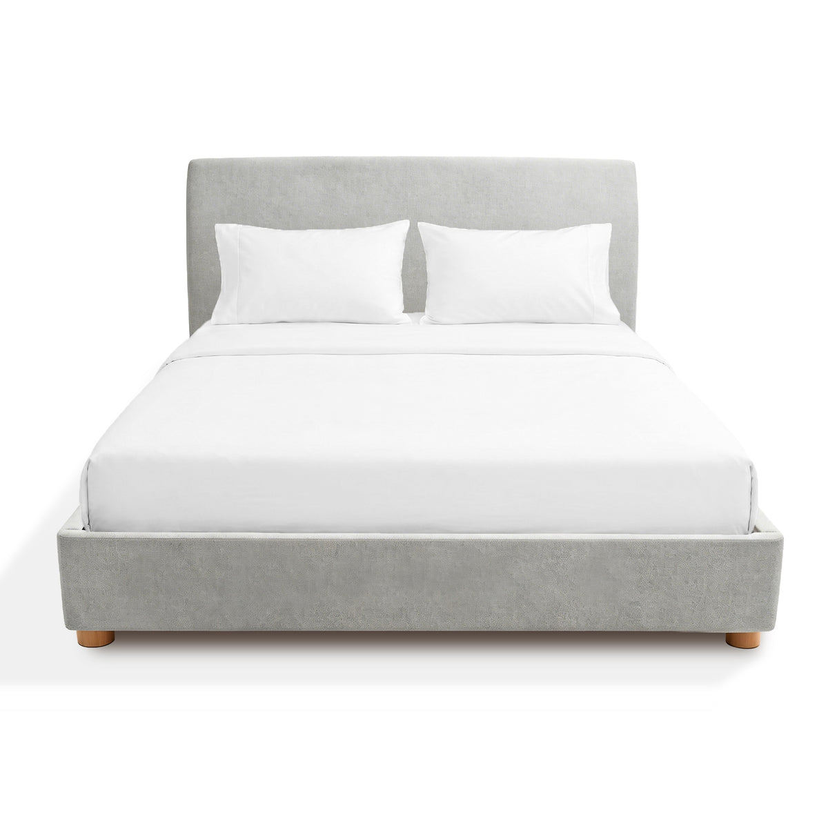 Gray Sonno divan bed frame upholstered with white bedding on a white background